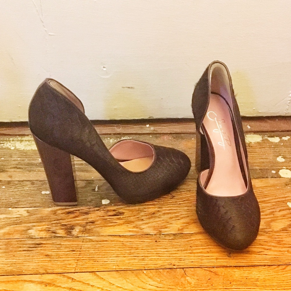 Dark brown and purple single Dorsay pumps.